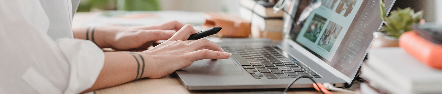 person typing on a laptop